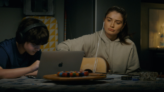 Orén Kinlan and Eve Hewson in "Flora and Son," premiering September 29, 2023 on Apple TV+.